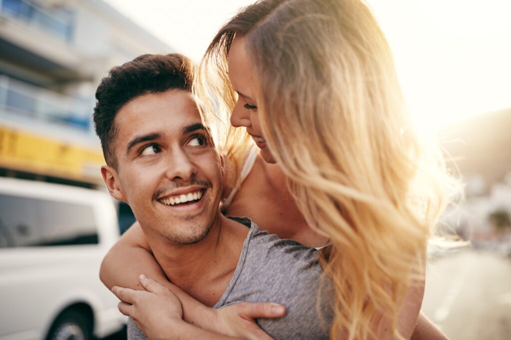 Laughing young couple having fun in the city